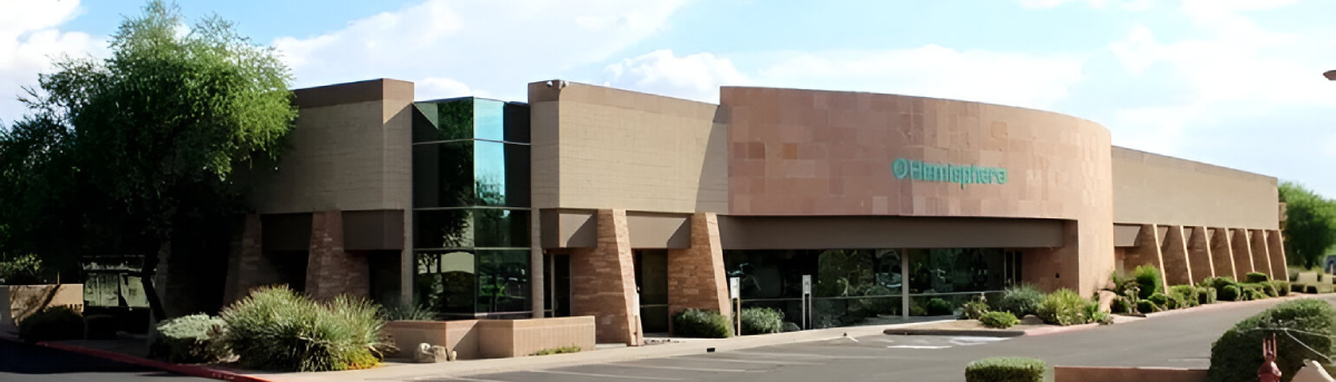A building with a large window on the side of it.