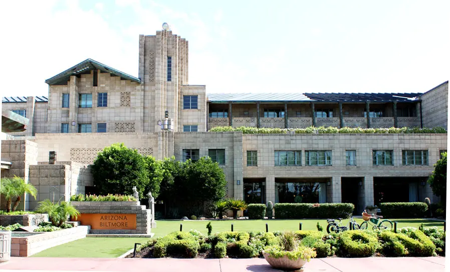 A building with a large lawn in front of it.