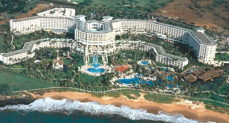 A large hotel with pools and water slides.