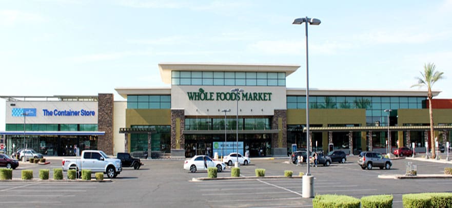 A whole foods market is shown in the parking lot.