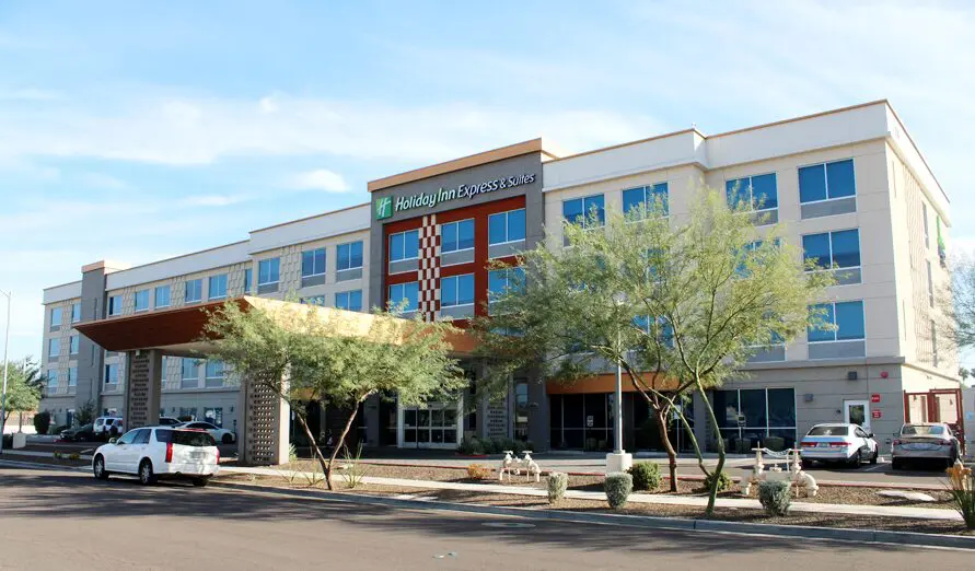 A large building with trees in front of it.